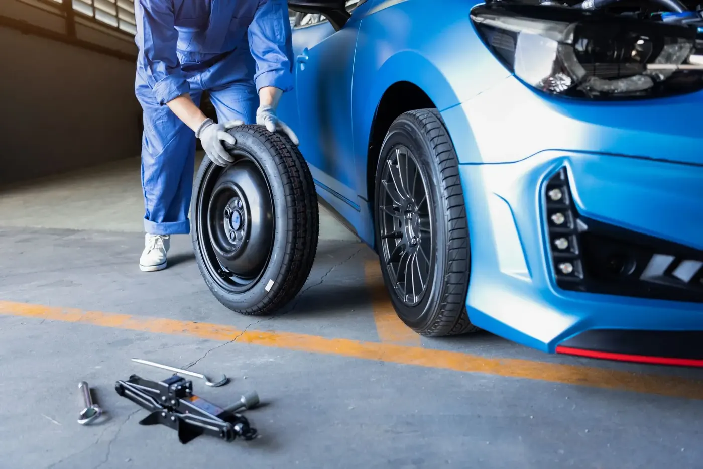 Specialist tools removing a locking wheel nut without the key